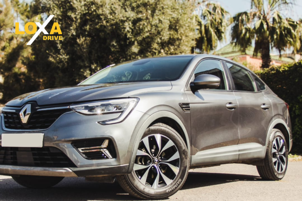 Car rental pickup at Marrakesh Menara Airport with customer collecting keys upon arrival